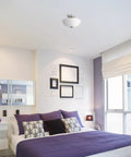 Modern bedroom with 13 Inch Two Light Semi Flush Mount Ceiling Light In Brushed Nickel With Chrome Accents And Frosted Glass Shade