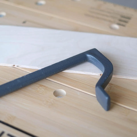 8 Inch Bench Holdfast Clamps for Woodworking, Heavy Duty Hold Downs, close-up of steel clamp on woodwork bench with dog holes