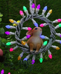 Easter String Lights LED Multi Color Glass C3 Bulbs 50 Count on white wire with a decorative rabbit in center, outdoor setting.