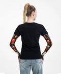 Snag These Fly Ice Silk Arm Sleeves With Cute Cat Graphics And Grippy Thumb Holes Offering Ultra Cool UV Shielding For Hot Days Of Running Cycling Or Driving shown on a woman from behind.