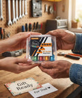 Hands holding a packaged Six Piece One Quarter Inch Hex Shank Drill Bit Holder Keychain in a workshop setting.