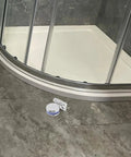 Premium Glass Door Hinge With 180 Degree Fixed Clamp For Frameless Showers And Kitchen Cabinets on tiled floor.