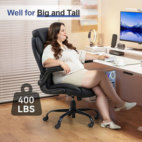 Woman sitting in 400 Lbs Capacity Big And Tall Leather Executive Office Chair With Padded Flip Up Armrests Cushy Comfort Heavy Duty