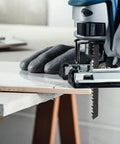 Rock Solid T Shank Jigsaw Blades Beefy High Carbon Steel Jig Saw Replacements For Cutting Wood Hardwood Metal Pvc And Plastic With No Fuss Quick Swap Design in use cutting through white material.
