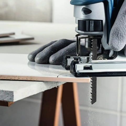 Rock Solid T Shank Jigsaw Blades Beefy High Carbon Steel Jig Saw Replacements For Cutting Wood Hardwood Metal Pvc And Plastic With No Fuss Quick Swap Design in use cutting through white material.