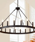 Black Wagon Wheel Chandelier 40 Inch With 20 Lights hanging in room with high ceiling, showcasing farmhouse round industrial design.