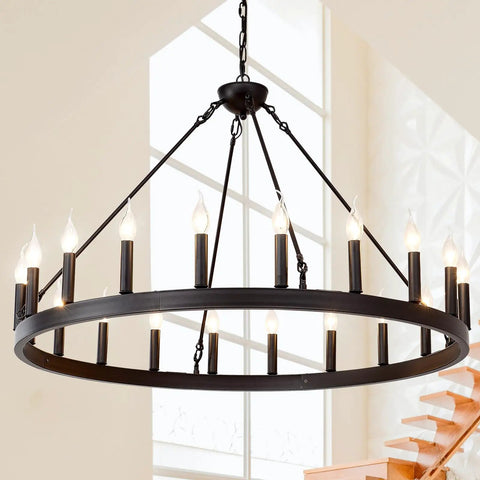 Black Wagon Wheel Chandelier 40 Inch With 20 Lights hanging in room with high ceiling, showcasing farmhouse round industrial design.