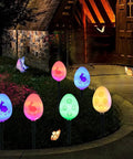20 LED Solar Easter Egg Lights Outdoor Stake With 25 Ft Cord, 8 Modes Waterproof displaying colorful illuminated eggs in garden
