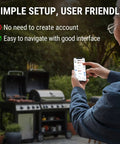 User holding smartphone with app interface near BBQ grill, showcasing 650 Ft Wireless Bluetooth Meat Thermometer setup and usage.