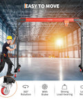 Heavy Duty 2200 Lbs Gantry Crane With 8 To 12 Ft Adjustable Height, worker moving portable crane in industrial space.