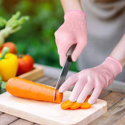 Cut Resistant Gloves Level 5 Food Grade For Kitchen Safety Medium Pink HPPE Knitted Fibers providing protection while slicing carrot
