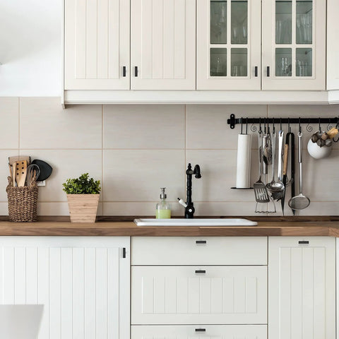 Modern kitchen with white cabinets featuring 30 Pack 2 Inch Square Cabinet Pulls Matte Black Stainless Steel Kitchen Drawer Pulls.
