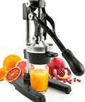Extra Large Cast Iron Juicer Hand Press Citrus Squeezer for fresh orange, pomegranate, lemon juice, heavy duty black cast iron, side view.