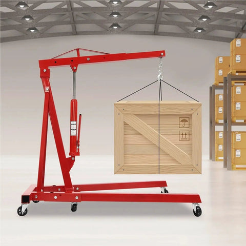 Heavy Duty Two Ton Hydraulic Engine Hoist Crane With Telescopic Boom Foldable Design lifting a wooden crate in a garage.