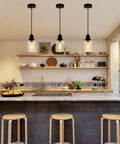 Slick Five Point Five Inch Seeded Glass Mini Pendant Light Featuring Badass Black Metal Hanging Fixtures For Kitchen Island And Dining Room above kitchen island.