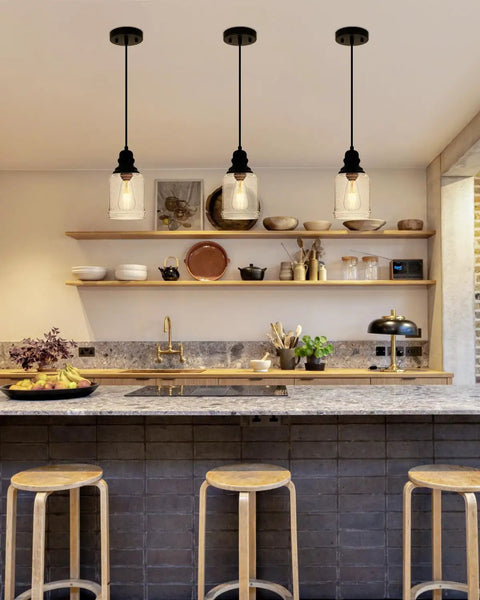 Slick Five Point Five Inch Seeded Glass Mini Pendant Light Featuring Badass Black Metal Hanging Fixtures For Kitchen Island And Dining Room above kitchen island.