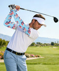 Stay Fresh With These Dope Cooling Arm Sleeves Shielding Bold Tattoo Ink Under Blazing Sun While You Crush Cycling Or Fishing Trips Quick Drying Stretch Polyester Delivers Solid UV Protection Daily worn by a golfer.