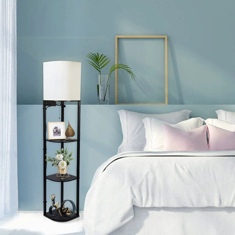 Smart RGB Shelf Floor Lamp With USB Ports And Power Outlet in bedroom next to bed, modern standing lamp in black with three shelves