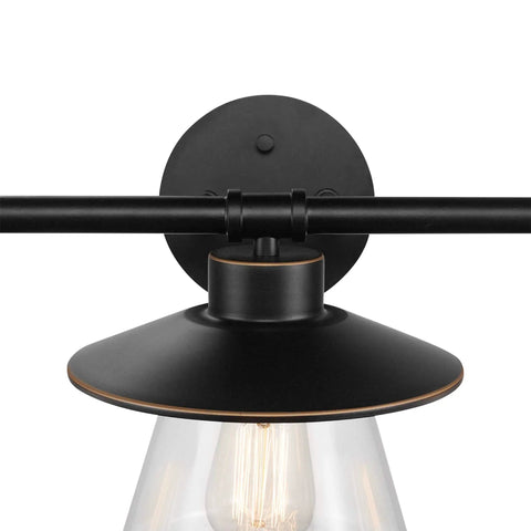 Close-up of Nate 5-Piece All-In-One Bathroom Set's 3-light vanity in oil rubbed bronze with clear glass shades for a warm modern farmhouse vibe.