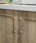 Installed six pack 5 inch knurled antique brass bar pulls with round end mounts on wooden kitchen cabinets