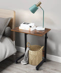 Rock Solid Height Adjustable Computer Desk With Smooth Rollin Casters For Easy Repositioning And Firm Lockdown Heavy Duty Steel Top used as a bedside table.