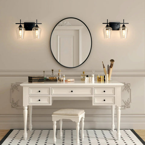 2 Light Vanity Light Fixture With Clear Glass Shades And Matte Black Finish over mirror in elegant bathroom setting