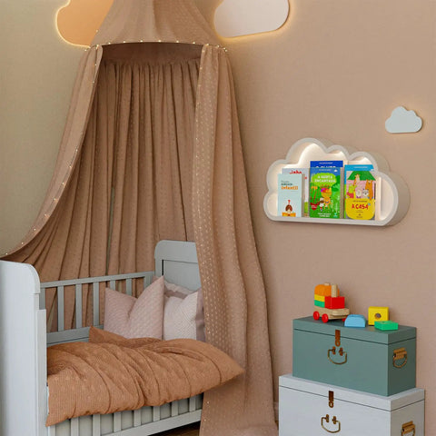 Nursery with canopy over crib, cloud-shaped shelf holding children's books, and toy chests beneath.