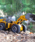 1/14 Scale RC Wheel Loader Remote Control Toy Truck - 2.4GHz Front Loader Construction Vehicle on rocky terrain