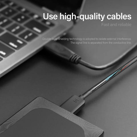 320GB Ultra Slim Portable External Hard Drive With USB 3.0 connected to laptop with copper cable, showcasing data transfer.