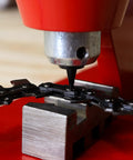 Heavy Duty Chainsaw Chain Breaker And Rivet Tool Kit for Quick Link Removal and Rivet Punching on a Stable Workbench in use