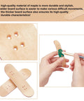 8 Pack Mini Fingerboard Set Maple Wood With Plastic Case Tiny Skateboards in close-up displaying holes and hand trick