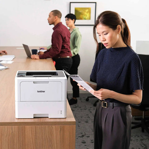 Office Printing Powerhouse Fast 50 Pages Per Minute Monochrome Laser Printer With Wireless Networking And Duplex Auto-Printing on desk