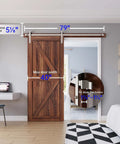 Heavy-Duty Brushed Nickel Sliding Barn Door Hardware Kit For 36-40 Inch Doors installed on a wooden door in a modern room.