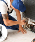 Installation of rollout furnace limit switch 47 22861 01 L350 2 pack SPST bimetal temperature control by technician.