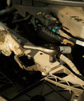 Mechanic uses Impact Socket Set 54 Piece Quarter Inch Drive, 6 Point SAE and Metric for auto repair under the hood.