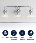 Chrome Three Light Bathroom Vanity Light With Clear Seeded Glass Shades, wall sconce above mirror showing LED bulbs included.
