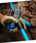 Awesome Electric Pipe Thread Cutter Kit For PvC & Metal in use, cutting blue PVC pipe with drill, gloved hand holding tool.
