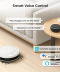 Robot Vacuum With Strong Suction And Long Battery Life For Pet Hair Slim Low Profile Quiet Cleaning Auto Docking And Self Charging Wi Fi App And Alexa Control Great For Hard Floors And Everyday Cleaning M210 next to couch and voice control devices