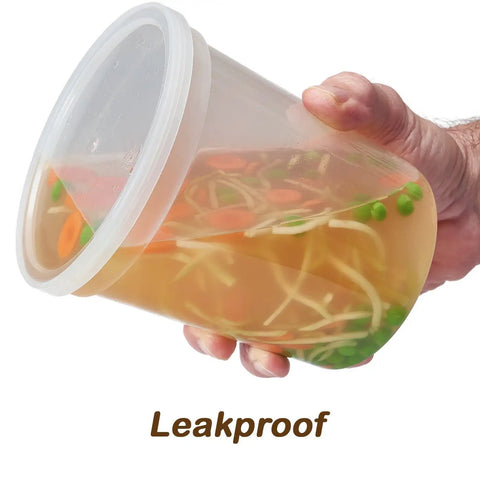 32 Oz Deli Style Food Storage Containers With Lids Pack Of 24 For Grab And Go Takeout And Meal Prep Leak Proof Freezer Safe Microwaveable Soup Containers Clear BPA Free Heavy Duty Plastic Stackable And Reusable held at an angle, showing leak-proof feature with soup inside.