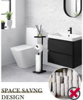 Matte Black Free Standing Toilet Paper Holder With Shelf beside toilet and sink in modern bathroom setting