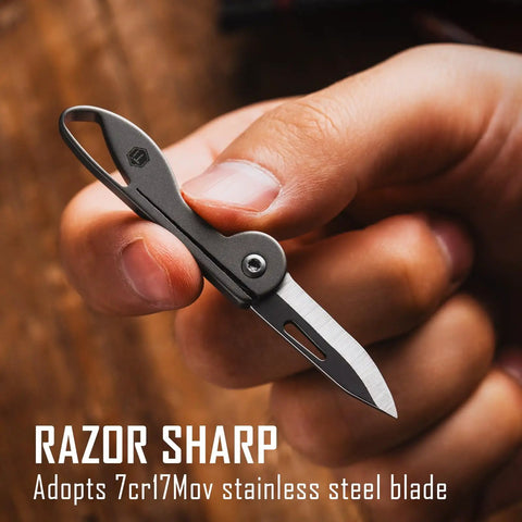 Mini Titanium Pocket Knife For Everyday Carry With Razor Sharp Folding Blade shown being held by hand