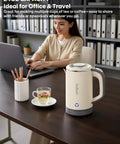 On The Go Grab And Go Portable Electric Kettle 24oz Mini Travel Kettle for Camping and Office on desk with woman working.