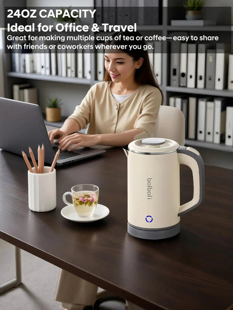 On The Go Grab And Go Portable Electric Kettle 24oz Mini Travel Kettle for Camping and Office on desk with woman working.