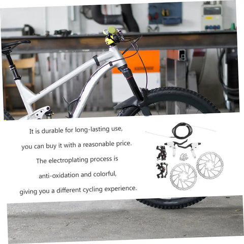 Top Shelf Mountain Bike Disc Brake Kit Featuring Robust Hydraulic Mechanical Calipers With Snappy Engagement And Rock Solid Coated Rotors For Reliable Trail Control on a bike frame in workshop.