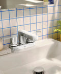 Two-Handle 4-Inch Centerset Chrome Bathroom Sink Faucet With Drain Assembly, Dope Modern Look, 3-Hole Install on a white sink