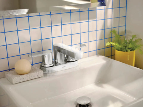 Two-Handle 4-Inch Centerset Chrome Bathroom Sink Faucet With Drain Assembly, Dope Modern Look, 3-Hole Install on a white sink