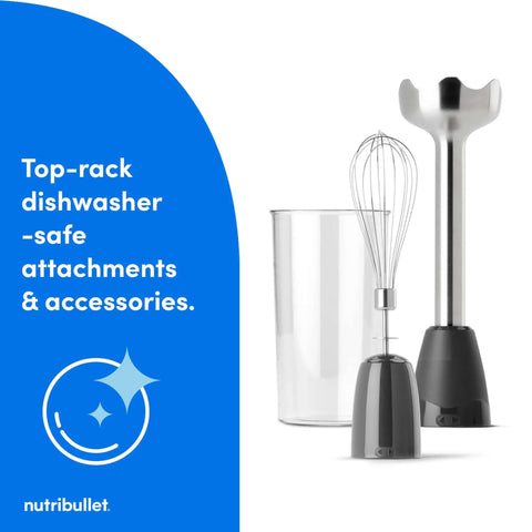 Lightweight Ergonomic Handheld Immersion Blender With Rustproof Stainless Steel Whisk Attachment And Heavy Duty Heat Resistant Shaft For Mixing Straight Out Of The Pot Dark Gray Kitchen Game Changer next to clear blending cup.