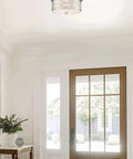 13 Inch Modern Lattice Drum Flush Mount Ceiling Light With Two Lights In Brushed Nickel Finish in a bright entryway.