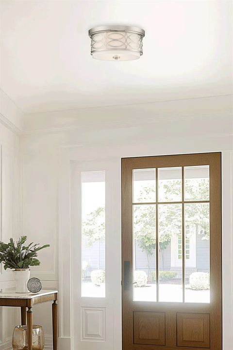 13 Inch Modern Lattice Drum Flush Mount Ceiling Light With Two Lights In Brushed Nickel Finish in a bright entryway.