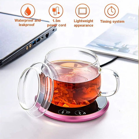Electric Coffee Mug Warmer Heats Your Daily Brew Piping Hot With Precise Auto Timer And Dual Heat Settings Built From Scratch Safe Tempered Glass on a desk with a clear tea cup.